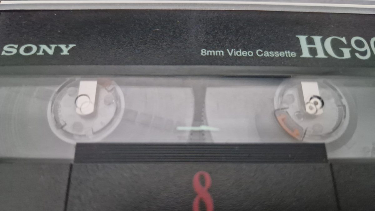 Close-up of a Sony 8mm Hi8 video cassette, a consumer tape format we transfer